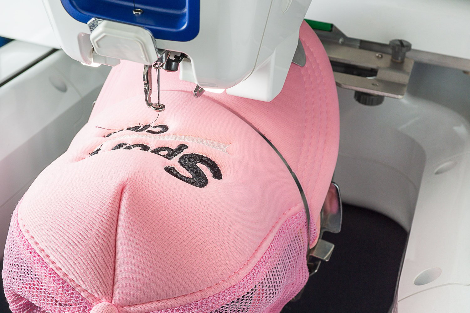 Embroidery machine and hat on the hoop